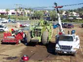 Construction site and equipment - scraper and crane truck.