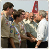 Photograph of President Bush shaking hands with one of the Boy Scouts, as Forest Service employees observe; photo courtesy of Redding Record Searchlight, Nathan Morgan.