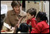 Laura Bush reads with children Wednesday, Jan. 26, 2006 during a visit to the kindergarten class at the Alice M. Harte Elementary School in New Orleans, La.