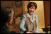 Mrs. Laura Bush smiles during an exchange Wednesday, Nov. 16, 2005, with Master Minoru Sawada, head calligraphy master of the Origin Arts Program, at the Suchiya-cho Townhouse in Kyoto, Japan.