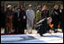 A calligrapher at the Beomeosa Temple in Busan entertains the spouses of APEC leaders Friday, Nov. 18, 2005, during the two-day summit.