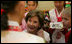 Laura Bush listens to children in the Children's Reading Room of the Busan Simin Metropolitan Municipal Library Friday, Nov. 18, 2005, in Busan, Korea.