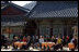 Sitting in the Korean sunlight, Laura Bush is joined by spouses of APEC leaders at the Beomeosa Temple in Busan for a morning tea ceremony.