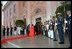 Escorted by President and Mrs. Bush past a military honor guard, President Fox and his wife Martha Sahagun de Fox enter the White House through it's North entrance, which is reserved for formal occasions.