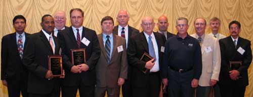 MMS Associate Director Chris Oynes, District Operations Chief Rishi Tyagi (Pacific), and Acting Regional Director Lars Herbst (GOM), presented awards to MMS Offshore Inspectors. Pictured from left to right are Rishi Tyagi, Freddie Mosely, Chris Oynes, Tom Basey, Lars Herbst, Jerry Freeman, Jim Hail, Leo Dartez, Henry Hite, Wayne Webster, Randy Howell, and Ralph Vasquez. (Not pictured Bernie Fink and R.B. Tate.)