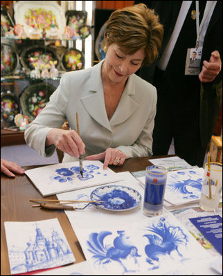 Mrs. Laura Bush participates in an arts and crafts demonstration Monday, July 17, 2006, during an exhibit at the Baltic Star Hotel on the grounds of the Konstantinovsky Palace Complex in Strelna, Russia, site of the G8 Summit that ended Monday.