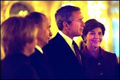 President and Mrs. Bush stand with Russian President Vladimir Putin and his wife as they begin a brief tour of Catherine's Palace outside St. Petersburg, Russia Friday, Nov. 22, 2002.