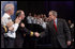 President George W. Bush greets local law enforcement officers after remarks on citizen preparedness at Lawrence Joel Veterans Memorial Coliseum in Winston-Salem, N.C. Wednesday, Jan 30, 2002.