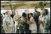 President George W. Bush greets military personnel at MacDill Air Force Base in Tampa, Fla., June 16, 2004.