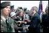 President George W. Bush meets with veterans and their families after delivering remarks during ceremonies marking the 60th anniversary of D-Day at the American Cemetery in Normandy, France, June 6, 2004.