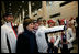 Laura Bush poses for photos with 2006 U.S. Winter Olympic athletes in Turin, Italy, Friday, Feb. 10, 2006 before the Opening Ceremony.