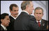 Canada's Prime Minister Paul Joseph Martin has the attention of President George W. Bush and fellow leaders of the Americas Friday, Nov. 18, 2005, as they meet at the Chosun Westin Hotel in Busan, Korea. Listening are, from left: Peru President Alejandro Toledo and Mexico President Vincente Fox.