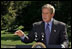 President George W. Bush discusses his Clear Skies Initiative in the East Garden Tuesday, Sept. 16, 2003. The initiative mandates a 70 percent cut in air pollution from power plants over the next 15 years, including the first-ever national cap on mercury emissions. 