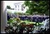 President George W. Bush approached the podium for the presentation ceremony of Commander-in-Chief's Trophy to the Air Force Academy football team in the Rose Garden Friday, May 17, 2002. "I'm proud of what this group of Americans have done on the football field. No more proud than those who wear the blue, I might add. And I'm proud of your commitment to our country," said the President in his address. 