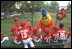 The San Diego Chicken visits the Rockies dugout before the game begins during a tee-ball game on the South Lawn May 6, 2001.