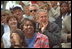 The President and Mrs. Bush watch the action during a tee-ball game on the South Lawn May 6, 2001.