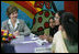 Mrs. Laura Bush listens to a young woman during an informal group discussion with teachers and students on her tour of Prayas, Thursday, March 2, 2006, in New Delhi, India.