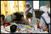 Mrs. Laura Bush is introduced to a young child, Thursday, March 2, 2006, during her visit to Mother Teresa's Jeevan Jyoti (Light of Life) Home for Disabled Children in New Delhi, India.