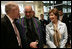 Mrs. Laura Bush and U.S Ambassador to Afghanistan Ronald E. Neumann speak with Afghanistan President Hamid Karzai, Wednesday, March 1, 2006, during the official dedication of the new U.S. Embassy building in Kabul, Afghanistan.