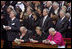 President George W. Bush and Laura Bush attend funeral services Friday, April 8, 2005, for the late Pope John Paul II in St. Peter's Square. The funeral is being called the largest of its kind in modern history.