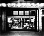 Automobiles in Window of the Washington-Cadillac Co.