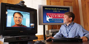 John Fortney, PhD (on screen), and Jeffrey Pyne, MD, are leading a study using videoteleconferencing to provide PTSD care to veterans in Arkansas, Louisiana and California, mostly in rural areas.
