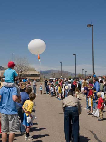 National Weather Service Forecaster Byron Louis launches a weather balloon for visitors at the National Oceanic and Atmospheric Administration in Boulder.