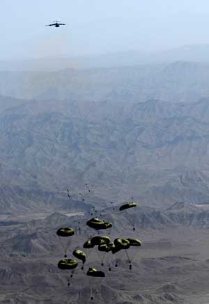 Cargo drop over Afghanistan's mountainous terrain.