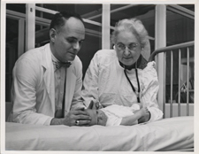 [Virginia Apgar with Dr. Alfred Bongiovanni]. [ca. 1960s].