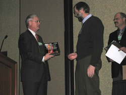 Picture of Corbin Newman presenting Nicholas Crookston an award, FVS Conference.