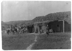 Family groups in front of a sod house, Coburg vicinity, Nebraska