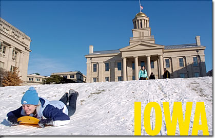 Students sledding on the west side of Old Cap