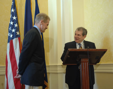NIAMS Director Dr. Stephen I. Katz (at podium) introduces Senator Bill Nelson (D-FL).