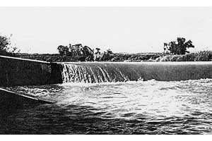 Black and white photo of a dam.