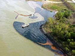 Containment booms and skimmers, T/V Westchester oil spill, Mississippi River, December 2000.  Photo by U.S. Coast Guard.