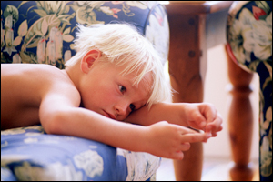 A boy lying on a sofa