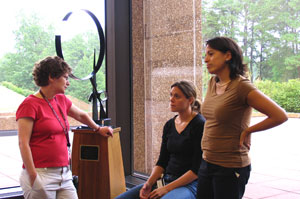 This photo from her first visit to NIEHS in July 2007 shows Milgram, left, talking with NTA leaders Jennifer Adair, Ph.D., seated, and Karina Rodriguez, Ph.D., right. 