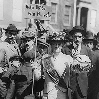 Suffragette in a group of men