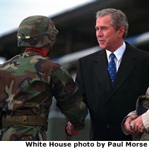 Photo of the President shaking hands with soldiers. White House photo by Paul Morse.