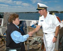 Senator Mikulski shakes hands with one of the ship's officers