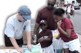 A family learning about the Hurricane Hazards