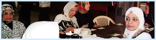 Iraqi librarians, here working on the national library's card catalog, sealed the stacks to protect them during the war and arranged to have 200,000 books and equipment trucked off-site for protection in mosques and homes.