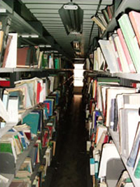 Iraqi national libray stacks are intact after the war. The Library's team was the first allowed to enter the stacks after librarians sealed them in April. Mary-Jane Deeb noted that other volumes were bound and cataloged but newer paperback volumes were not, suggesting that the library was not a high priority in Iraq's recent budgets.