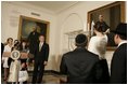 President George W. Bush and Laura Bush watch the lighting of the Menorah at the White House Thursday, Dec. 9, 2004. "We are honored to celebrate the miracle of Hanukkah in the White House this evening," said the President. 