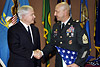 Defense Secretary Robert M. Gates congratulates U.S. Army retiree 1st Sgt. Vallez and thanks him for his service during a retirement ceremony on Fort Bliss, El Paso, Texas, April 30, 2008.