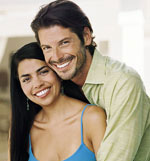 Image of Hispanic male/female couple embracing.