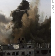 An explosion is seen where the Israeli military is bombing an area around alleged smuggling tunnels in Rafah, southern Gaza Strip, 14 Jan 2009