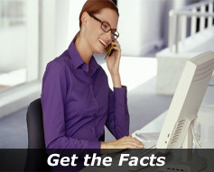 Smiling woman on cell phone at a computer "Get The Facts"