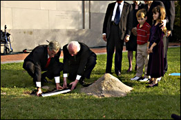 Elie Wiesel joins children in burying a time capsule marking the U.S. Holocaust Memorial Museum's 10th anniversary.
