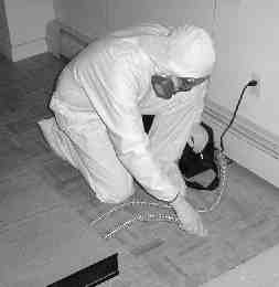 Collecting dust samples at a NYC residence after September 11, 2001